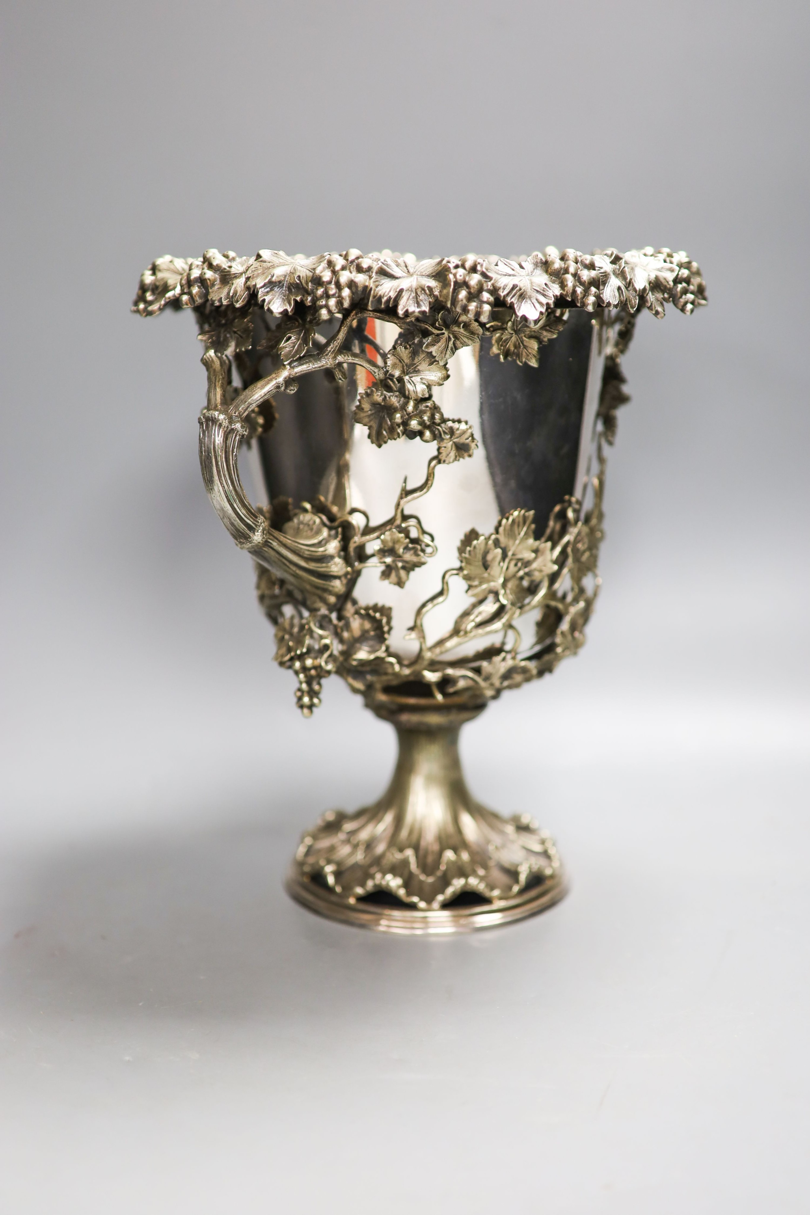 A Victorian campana shaped plated wine cooler, cast with fruiting vines 28cm